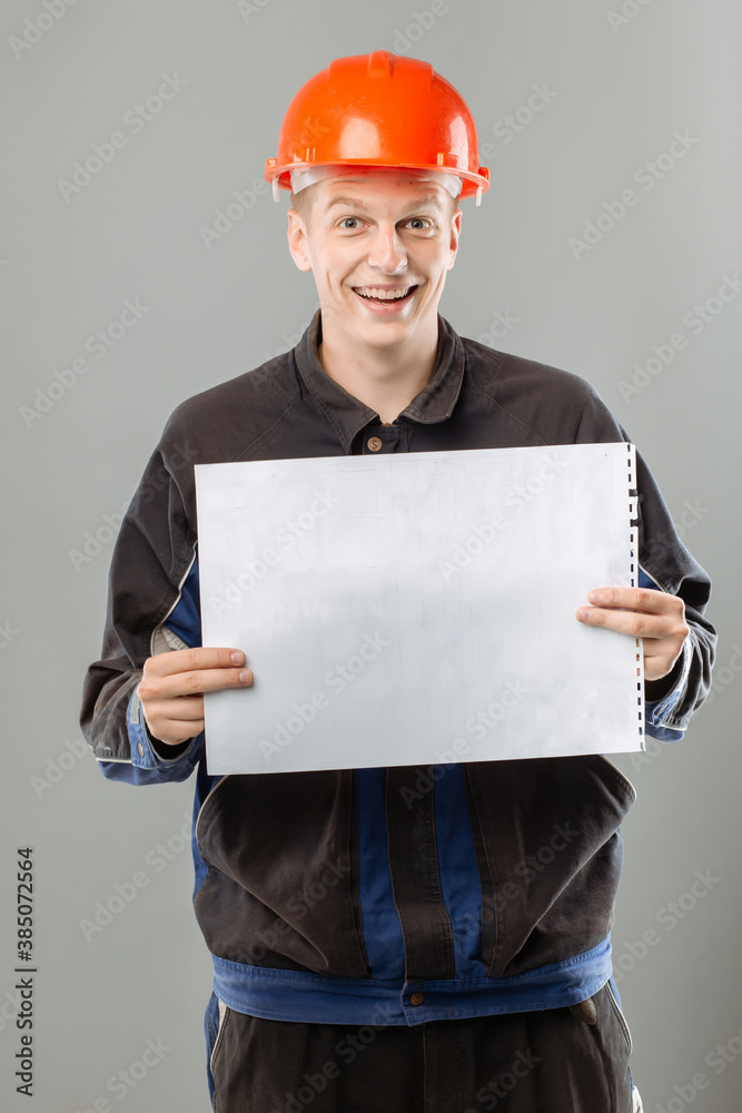 young engineer builder architect in helmet with blueprints and tools, on isolation young engineer builder architect in helmet with blueprints and tools, on isolation