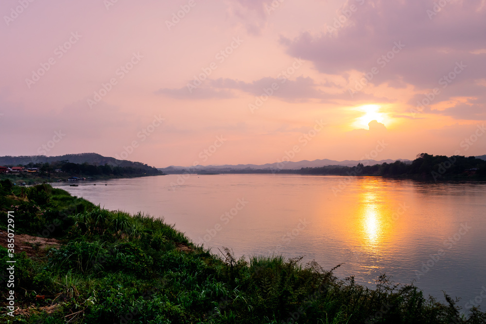 sunset over river in Thailand