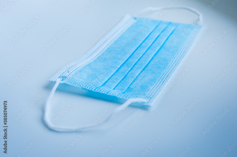 Medical protective mask on a blue background Medical protective mask on a blue background