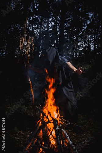 Sorcerer with marks on his body in the forest