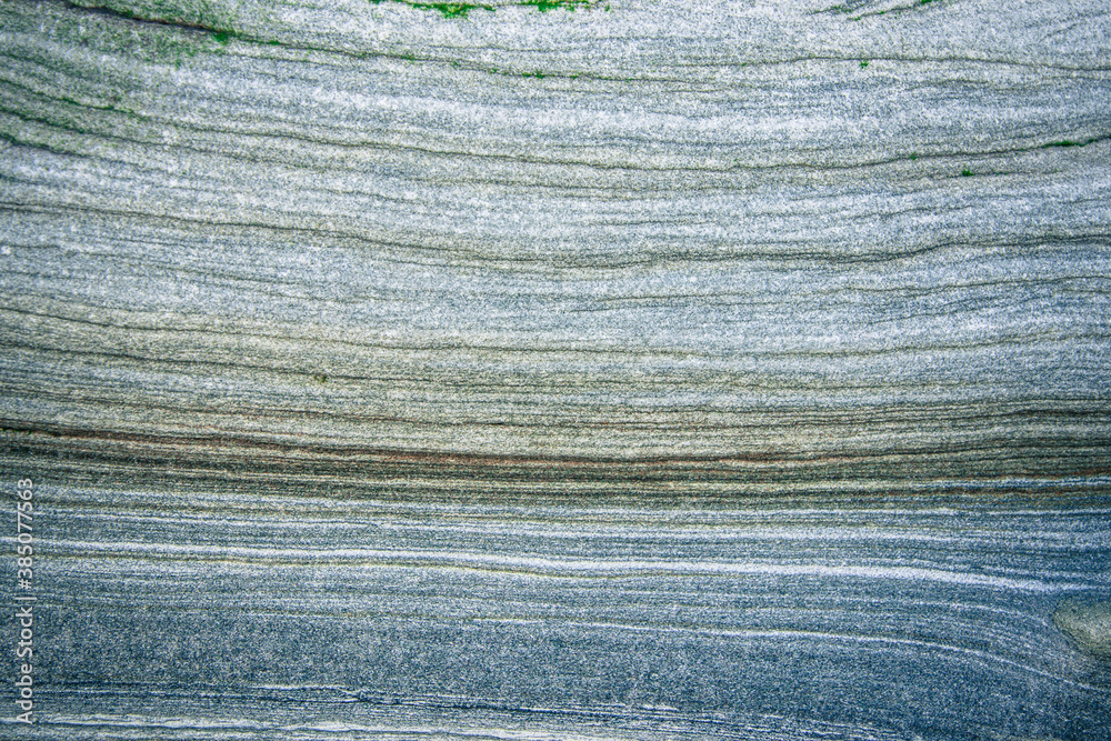 Obraz premium Rock layers - a colorful formations of rocks stacked over the hundreds of years. Interesting background with fascinating texture