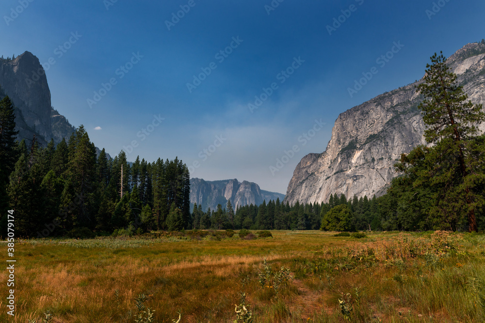 Scenic view of the Yosemite valley, with the surrounding rocky mountains, in California, USA. Scenic view of the Yosemite valley, with the surrounding rocky mountains, in California, USA.