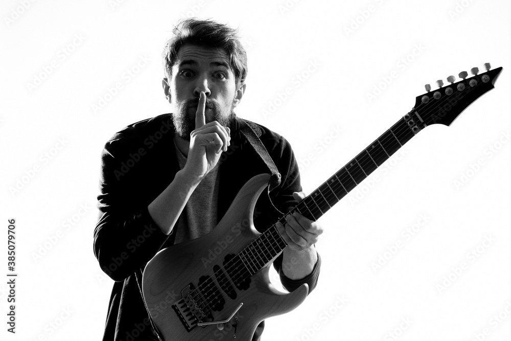 Obraz premium Musician with guitar rock star emotions entertainment modern performer