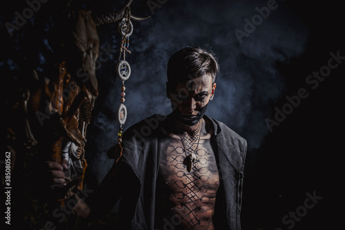 Slika na platnu Sorcerer with marks on his body in the forest