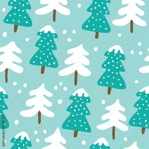 Christmas seamless pattern with trees on a blue background. © Elena Melnikova