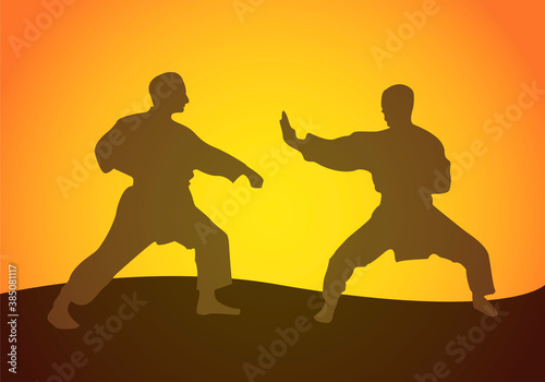 Gente luchando en karate en el atardecer.