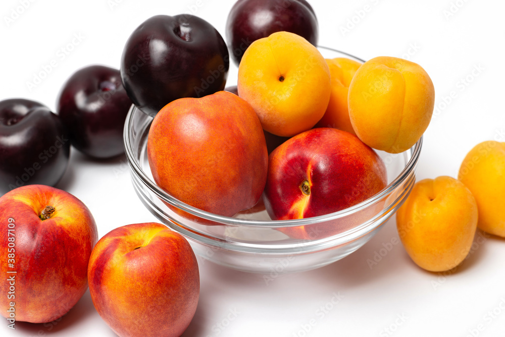 nectarine, peach and plum on a white background nectarine, peach and plum on a white background