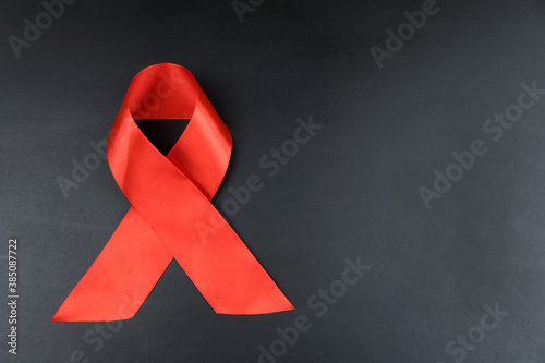 Red ribbon on black background