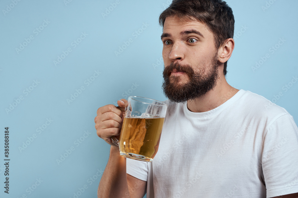 Drunk man beer mug fun white t-shirt lifestyle blue background Drunk man beer mug fun white t-shirt lifestyle blue background
