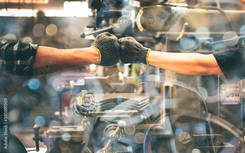 Experienced entrepreneurs, 2 engineers man Used hand for fist bump to show their cooperation For success teamwork, with blur soft of industrial machinery background, to people and synergy concept. © Anatta_Tan
