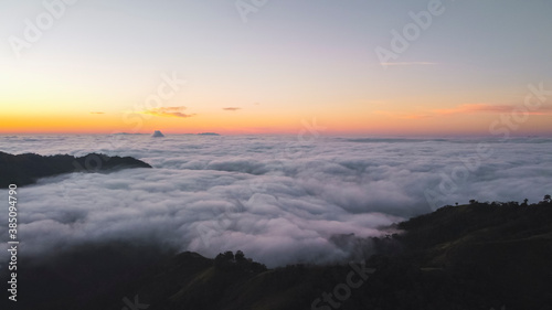View of a sunrise from a mountain surrounded by clouds © Yaikel Dorta