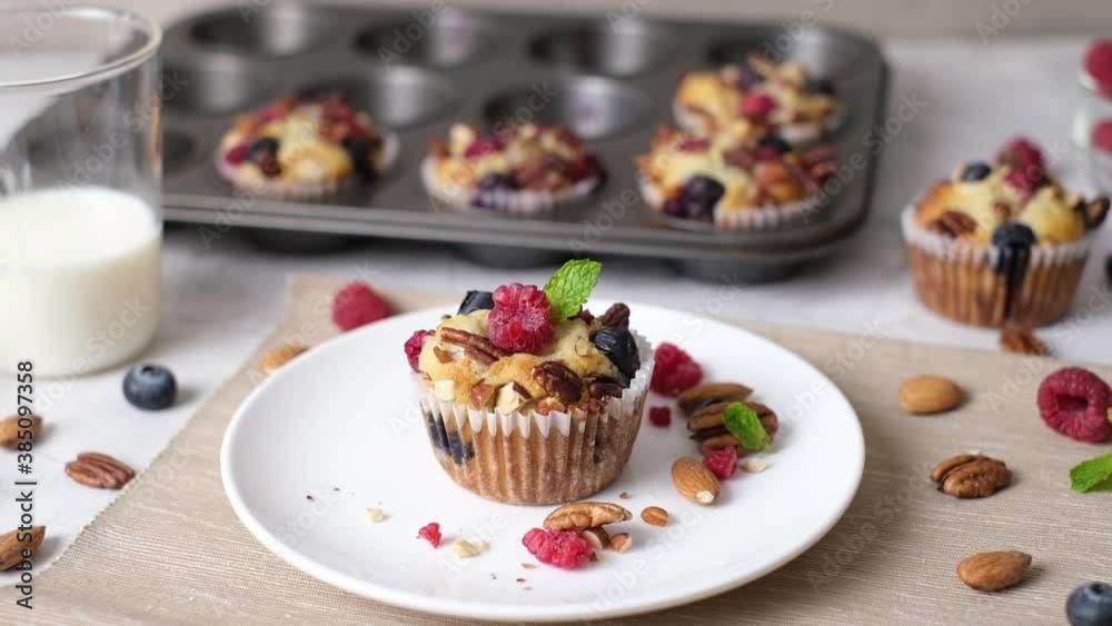 Mixed berry low carb Keto Diet muffin with almond and nut. set on cafe table. Mixed berry low carb Keto Diet muffin with almond and nut. set on cafe table.