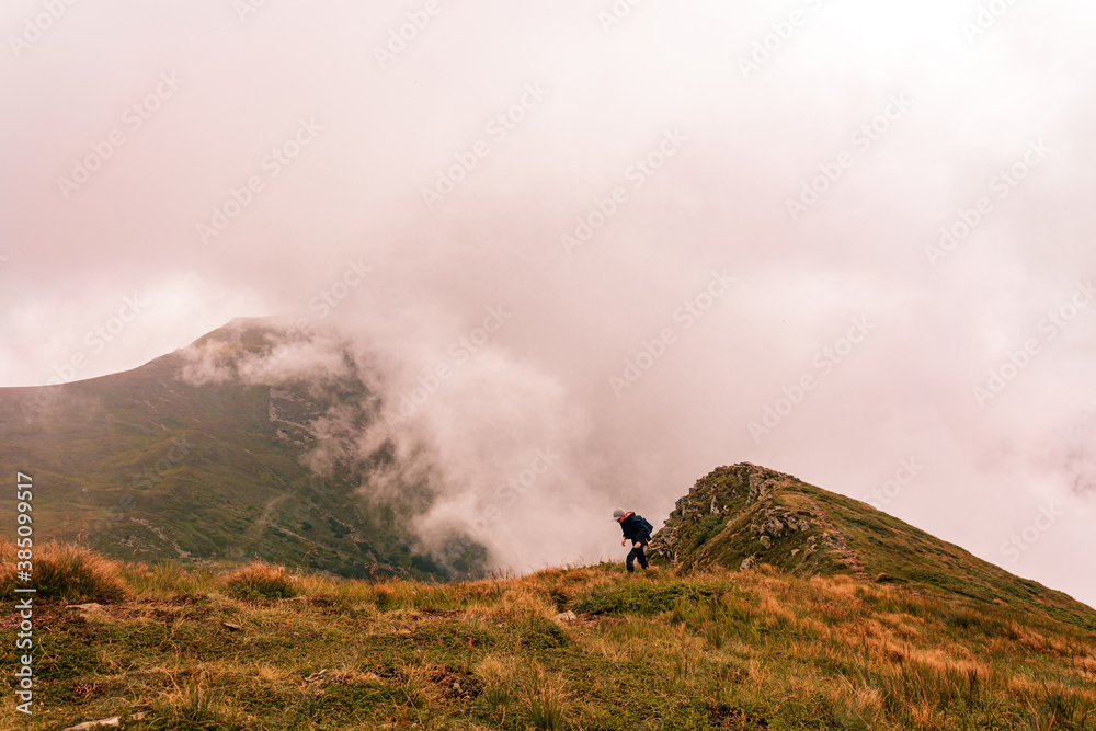 Montenegrin ridge in the clouds, Gutyn Tomnatyk mountain in the clouds, picturesque and fascinating magical landscapes from the mountain to the valleys.