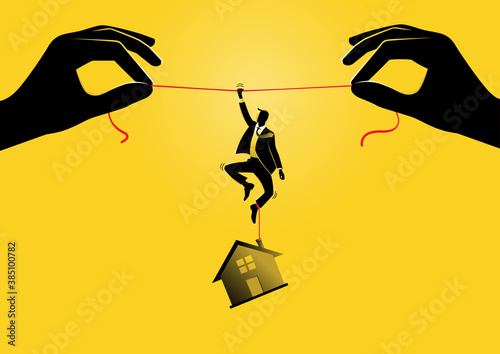 Businessman hanging on a rope