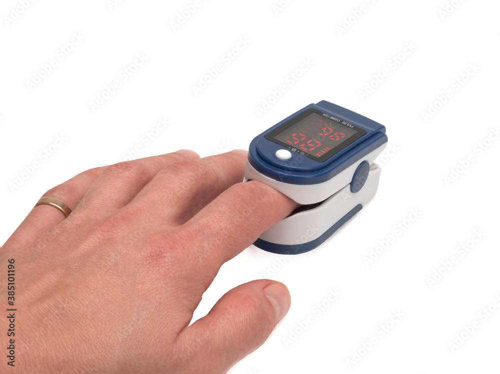 A pulse oximeter used to measure pulse rate and oxygen levels on white backgroud A pulse oximeter used to measure pulse rate and oxygen levels on white backgroud