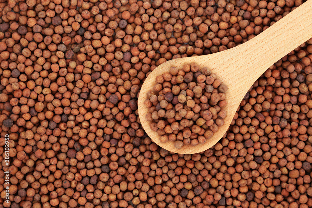 Healthy dried carlin peas in a wooden spoon and forming an abstract background. Very high in protein, low in fat, high in fibre, antioxidants & anthocyanins. Flat lay, top view. Healthy dried carlin peas in a wooden spoon and forming an abstract background. Very high in protein, low in fat, high in fibre, antioxidants & anthocyanins. Flat lay, top view.