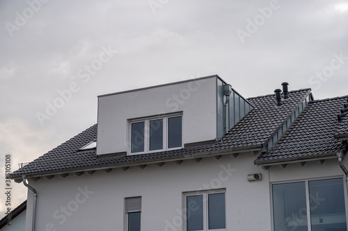 modern semi-detached house with flat roof dormer with aluminum cladding © MG-Pictures