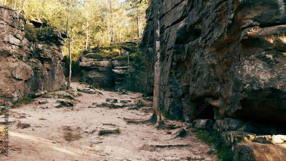 Way between the rocks in the forest Way between the rocks in the forest