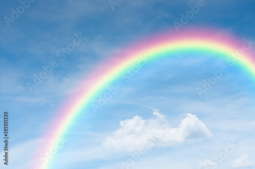 blue sky and clouds with rainbow © pushish images