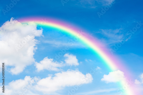 blue sky and clouds with rainbow © pushish images