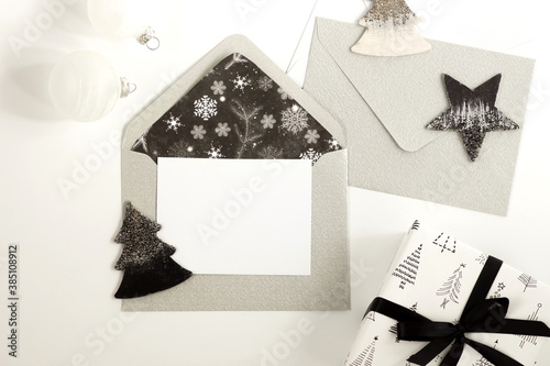 Christmas background with envelopes, invitation card, gift box, decorations i...
