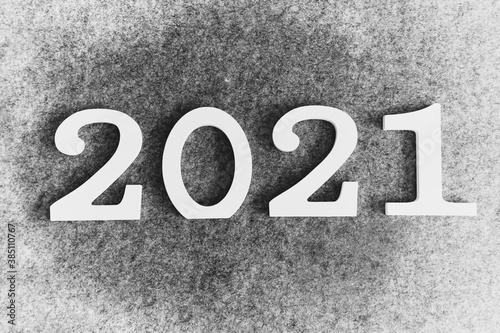 The inscription 2021 on a gray background with a frost effect.