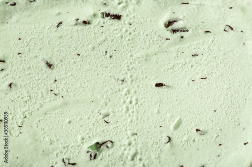 Fototapeta Naklejka Na Ścianę i Meble -  Abstract shot of mint choc chip ice cream, useful as a background or texture.
