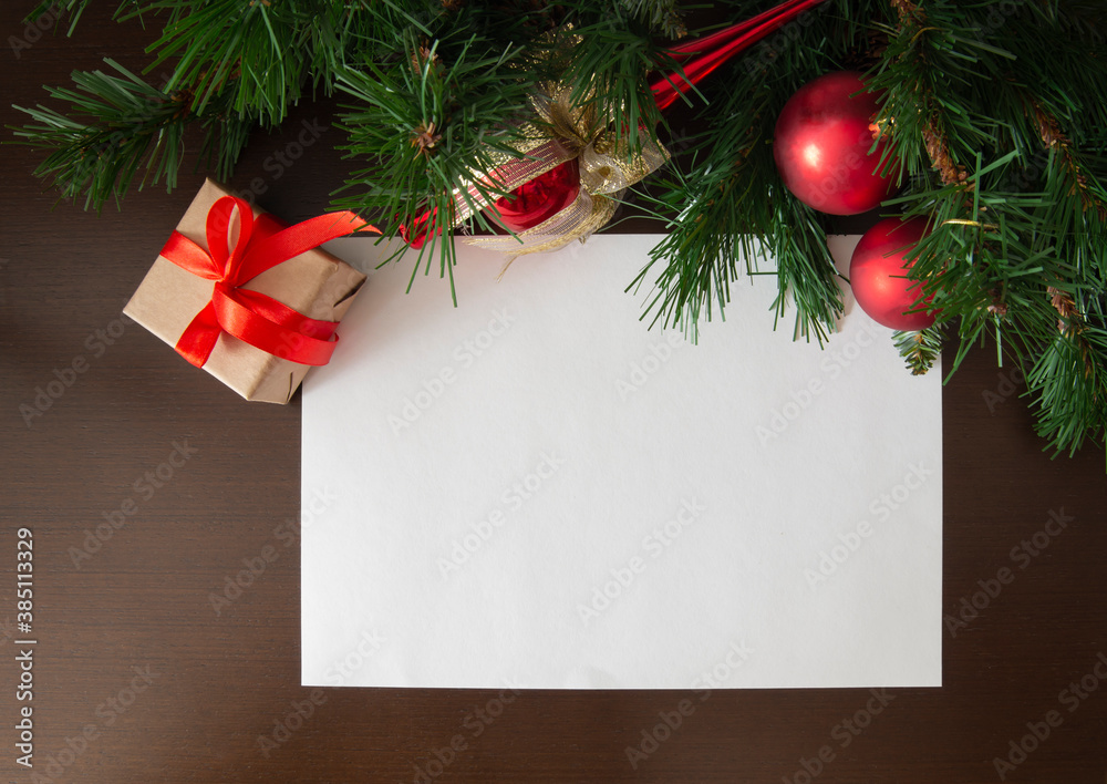 Obraz premium Christmas decoration with presents making a frame with copy space. Christmas themes. Top view. Greeting, design template, winter holidays background or frame