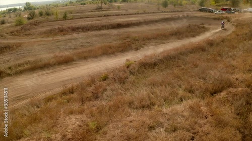 Racers on motorcycles participate in motocross cross-country in flight, jumps and takes off. Mud and dust. Teplodar, Ukraine, October 11, 2020. photo