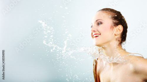 pretty woman with water splash. Copy space. Beautiful model