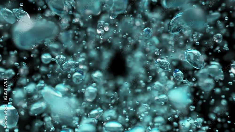 Explosion of water droplets into the camera in slow motion on an isolated black background.