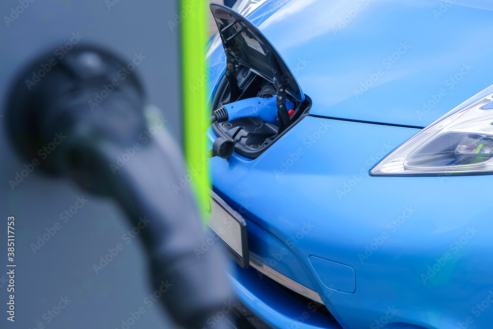 Naklejka premium Recharging of electric cars.