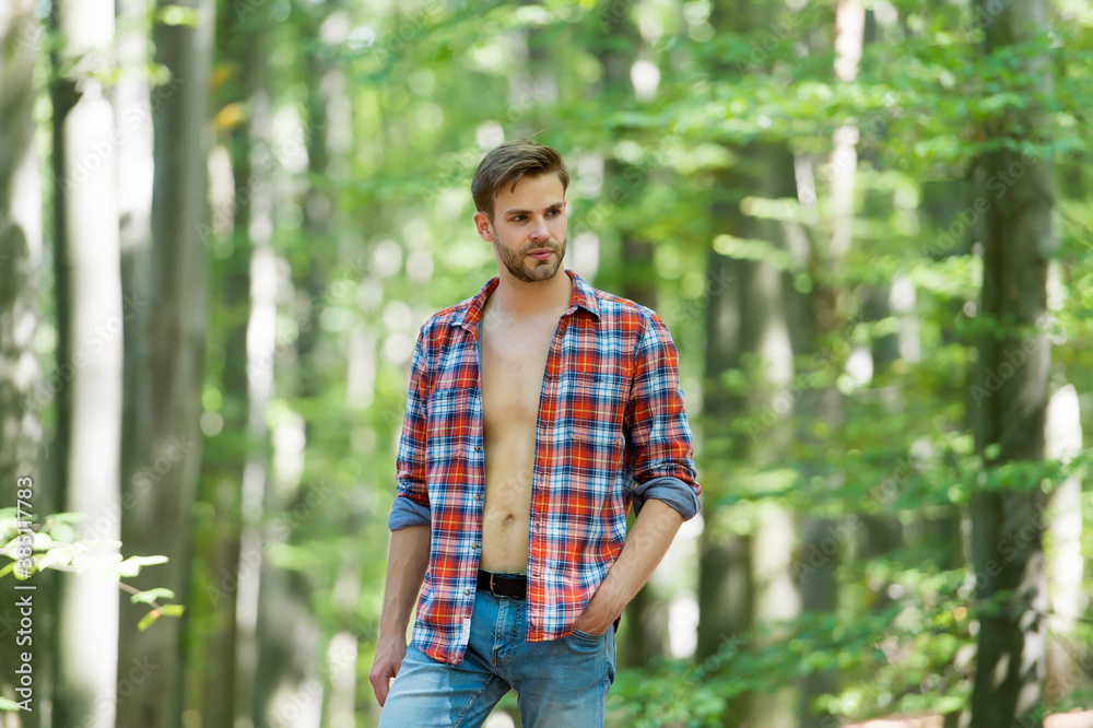 handsome man with bristle wear checkered shirt outdoor, male sexuality