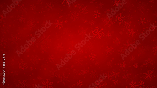 Christmas background of snowflakes of different shapes, sizes and transparency in red colors