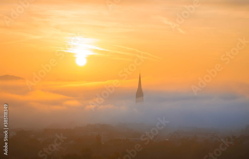 Cityscape of Graz with Church of the Sacred Heart of Jesus and historic buildings, in Graz, Styria region, Austria, at sunrise. Beautiful foggy morning over the city of Graz, in autumn © Aron M  - Austria
