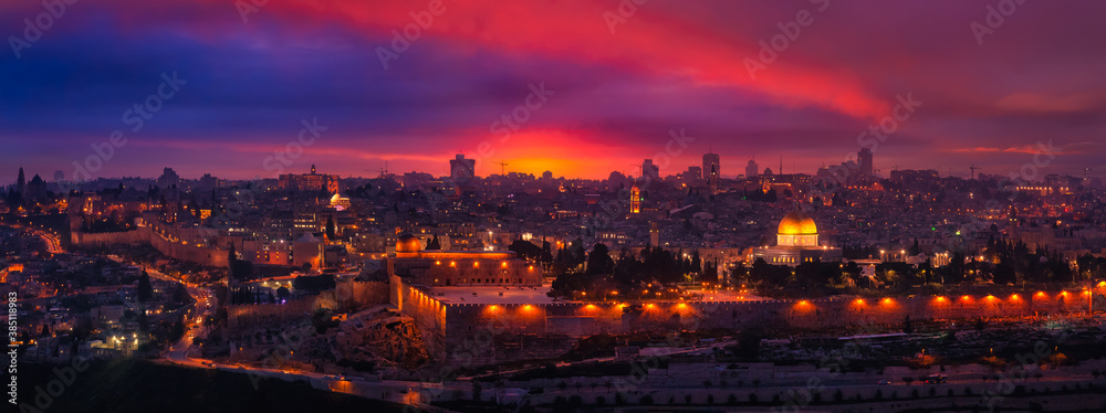 Beautiful aerial panoramic view of the Old City, Dome of the Rock and Tomb of the Prophets. Dramatic Colorful Sunset Twilight Artistic Render. Taken in Jerusalem, Capital of Israel.