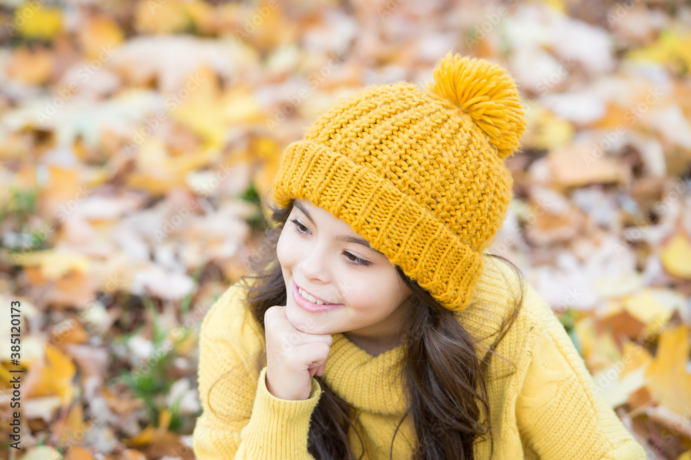 Feeling free and relaxed. autumn knitted fashion. romantic season for inspiration. happy childhood. girl relax in park. fall season beauty. enjoy day in forest. smiling kid in hat relax outdoor Feeling free and relaxed. autumn knitted fashion. romantic season for inspiration. happy childhood. girl relax in park. fall season beauty. enjoy day in forest. smiling kid in hat relax outdoor