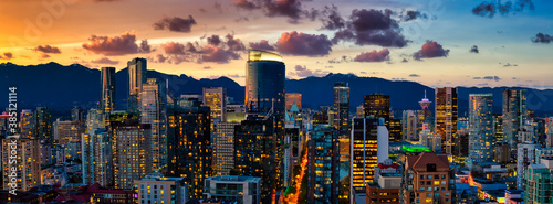 Aerial Panorama of the beautiful modern downtown city during the night after sunset. Vancouver, British Columbia, Canada. Colorful Clouds Artistic Render
