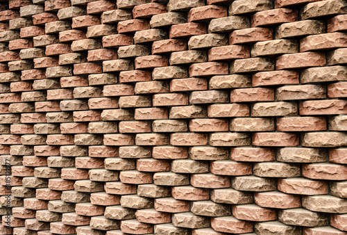 Beautiful brick wall made of torn decorative bricks
