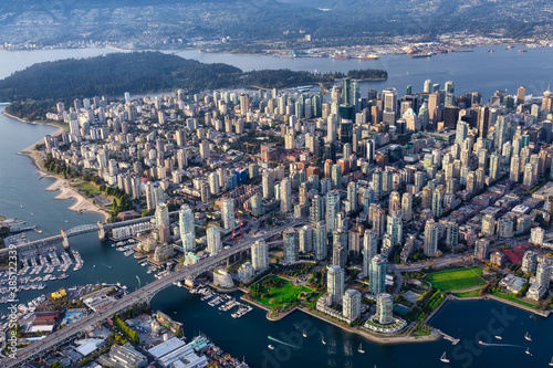 Downtown Vancouver City, British Columbia, Canada. Beautiful Aerial View from Above of a Modern Cityscape. Colorful Vibrant Sunset. Urban Buildings, Bridges and Streets. © edb3_16