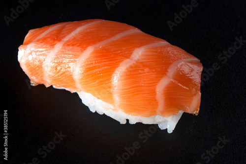 salmon sushi on black