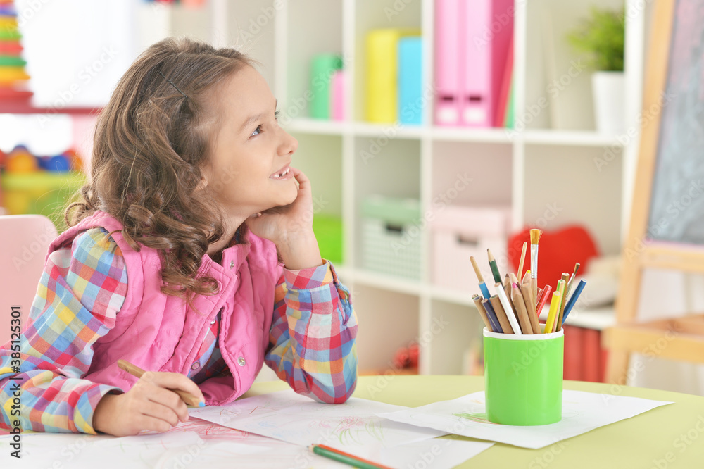 Cute beautiful smiling girl drawing at home Cute beautiful smiling girl drawing at home