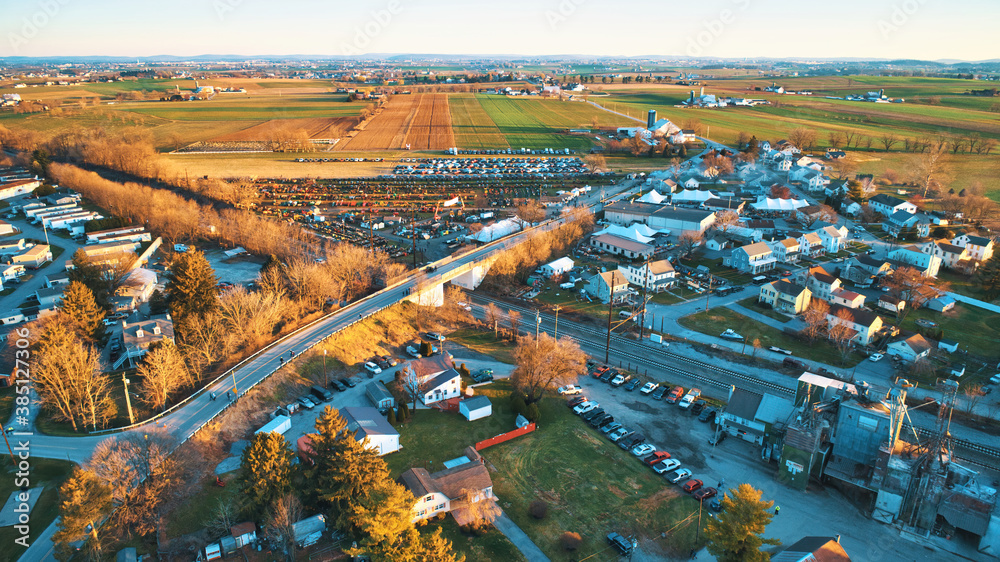 Aerial View of an Amish Mud Sale with Lots of Buggies and Farm Equipment on a Early Morning Winter Day