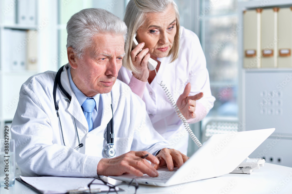 portrait of professional doctors working in cabinet portrait of professional doctors working in cabinet