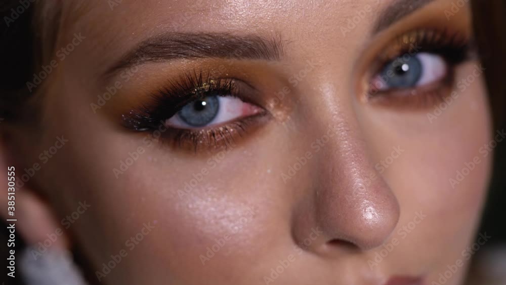 Blonde model with bright evening makeup. Beauty, fashion. Girl posing in studio with beautiful makeup 4K Blonde model with bright evening makeup. Beauty, fashion. Girl posing in studio with beautiful makeup 4K