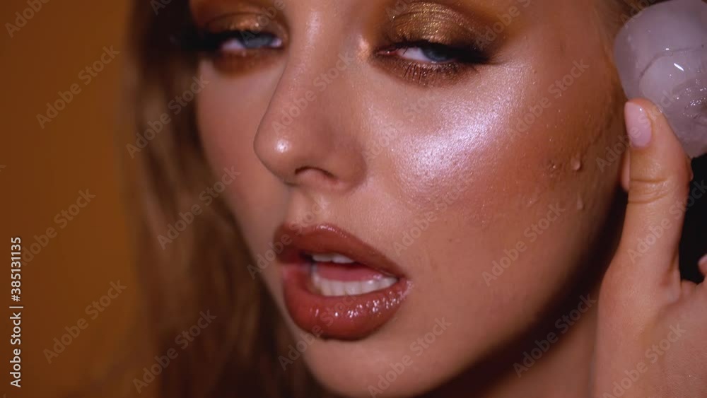 Blonde model with bright evening makeup. Beauty, fashion. Girl posing in studio with beautiful makeup 4K Blonde model with bright evening makeup. Beauty, fashion. Girl posing in studio with beautiful makeup 4K