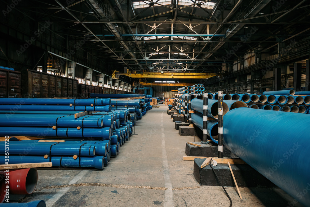 New cast iron pipes for pipeline construction in warehouse New cast iron pipes for pipeline construction in warehouse