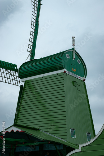 Dutch historic windmills near a channel at Zaanse schans.