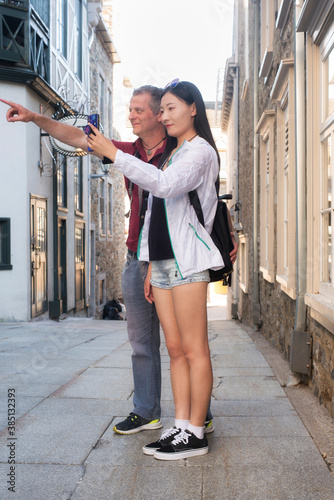 A mixed race couple traveling in quebec canada photo