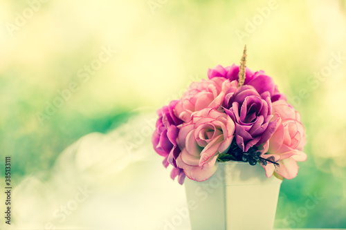 Vintage bouquet roses on blur green tree background